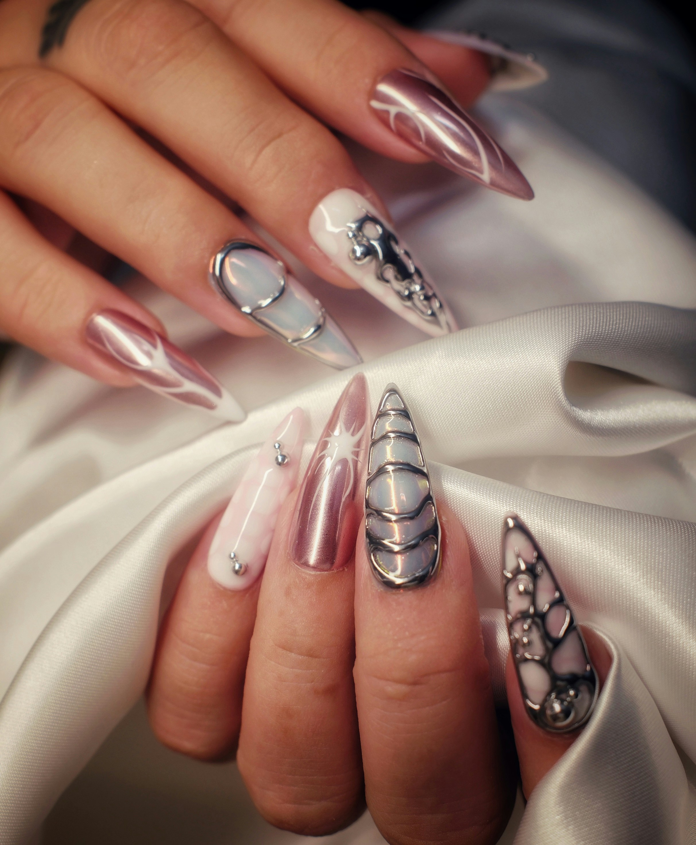 Instagram nail post featuring chrome manicure